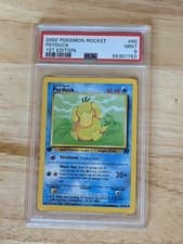PSA 9 Psyduck - 2000 Pokemon Team Rocket 1st Edition 65/82